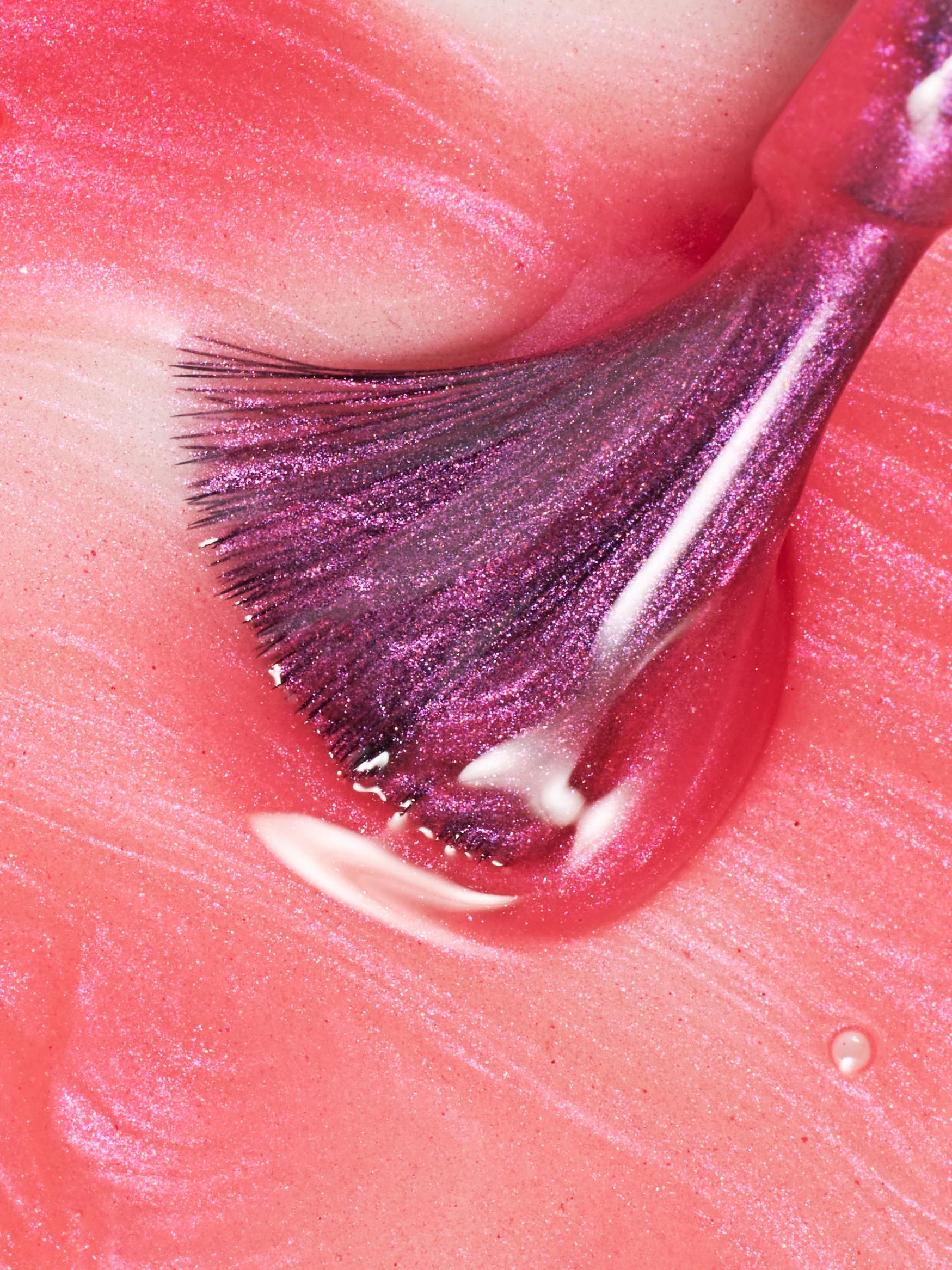 A pink brush with purple bristles.