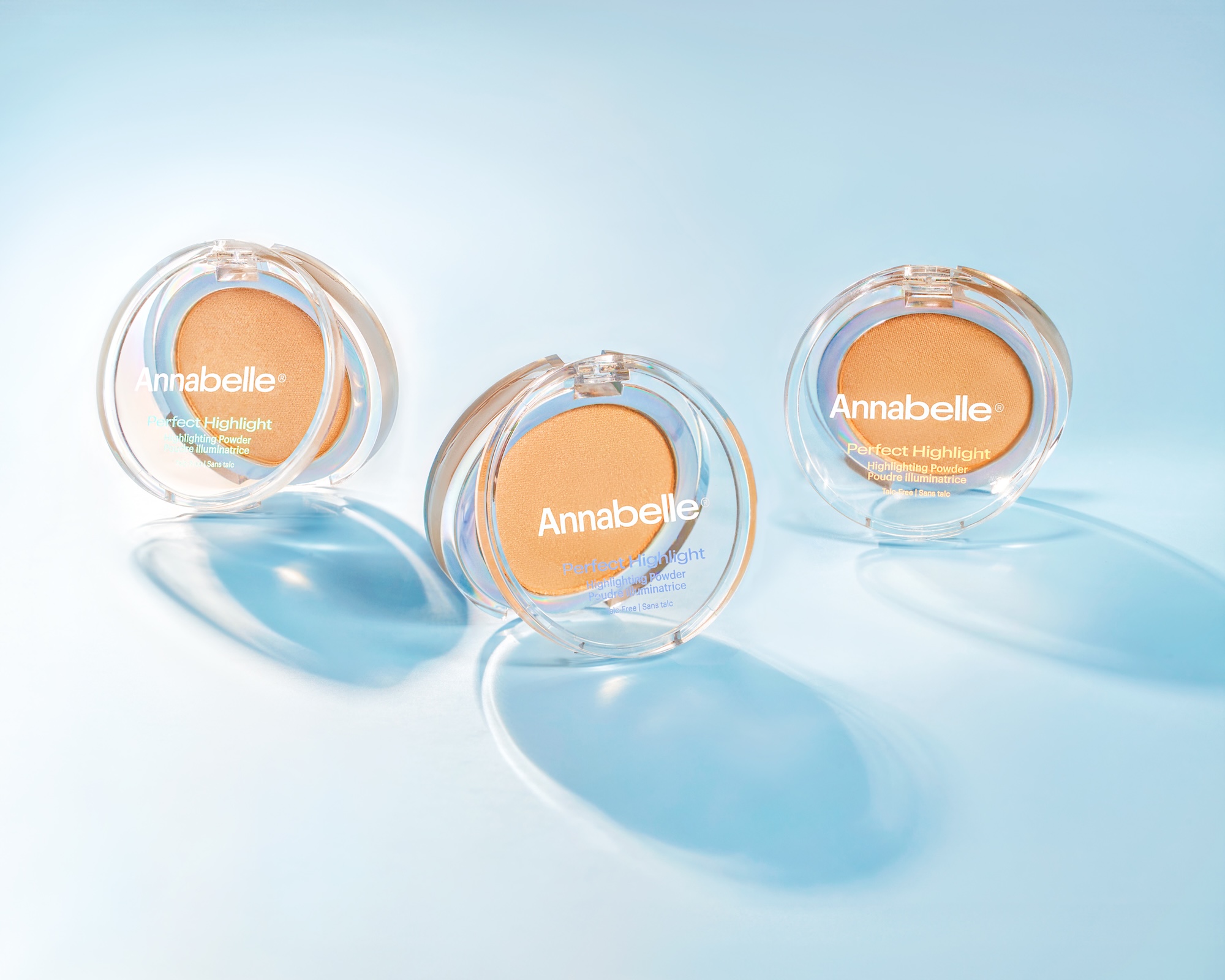 Three different shades of Anabelle makeup are displayed on a blue background.