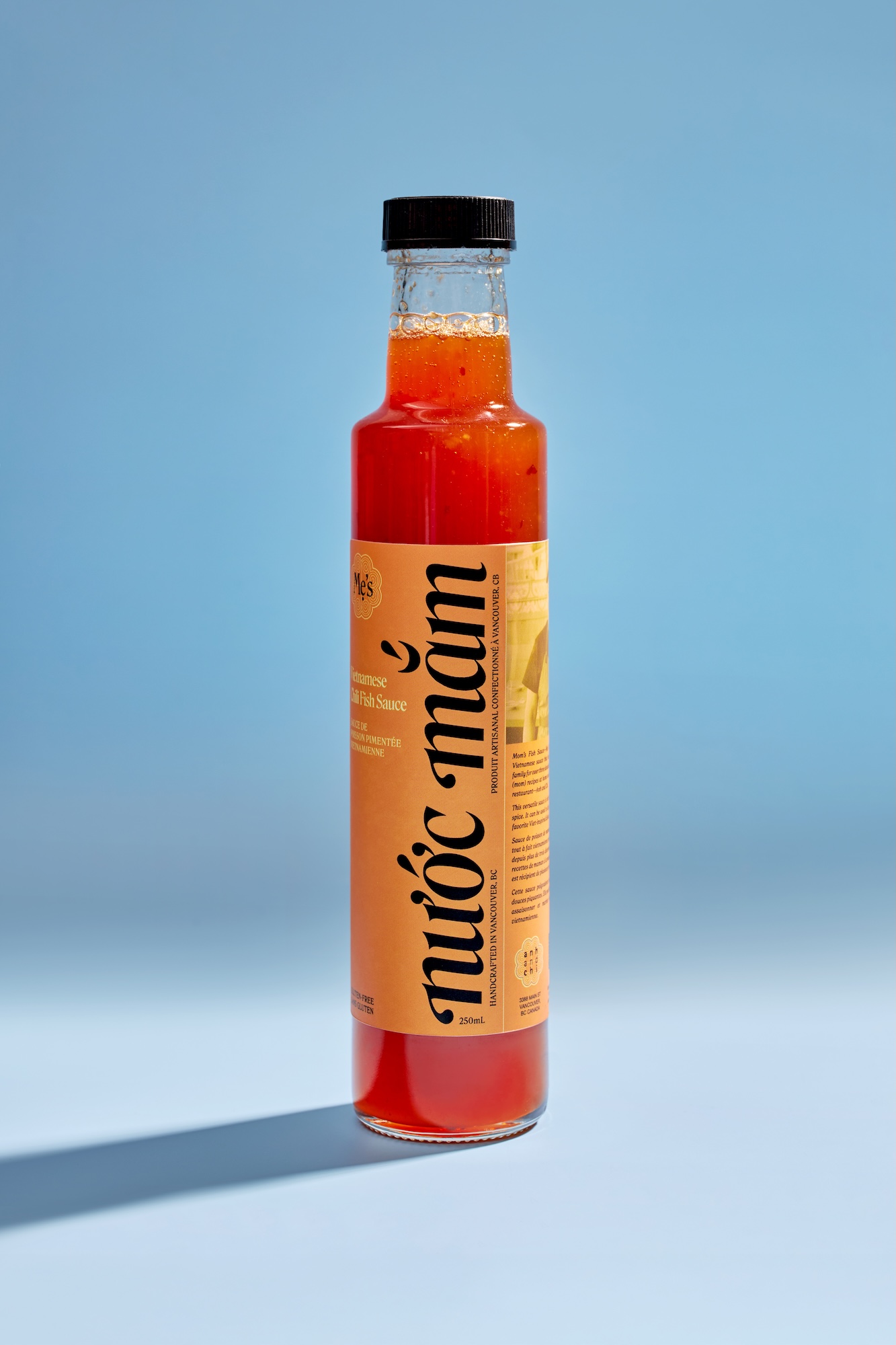 A bottle of Ahn and Chi sauce with a fish on the label.