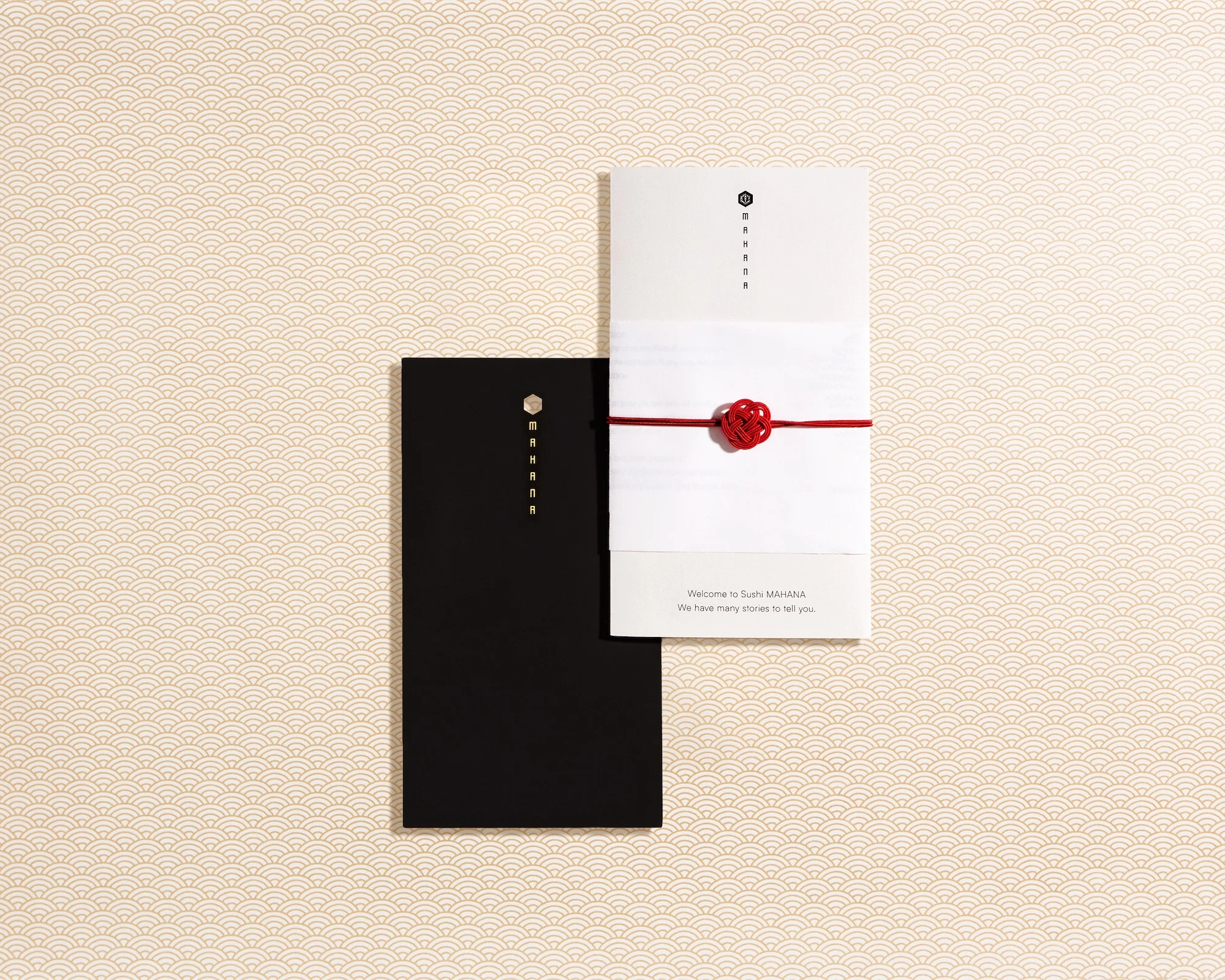 A black restaurant menu with a red ribbon.
