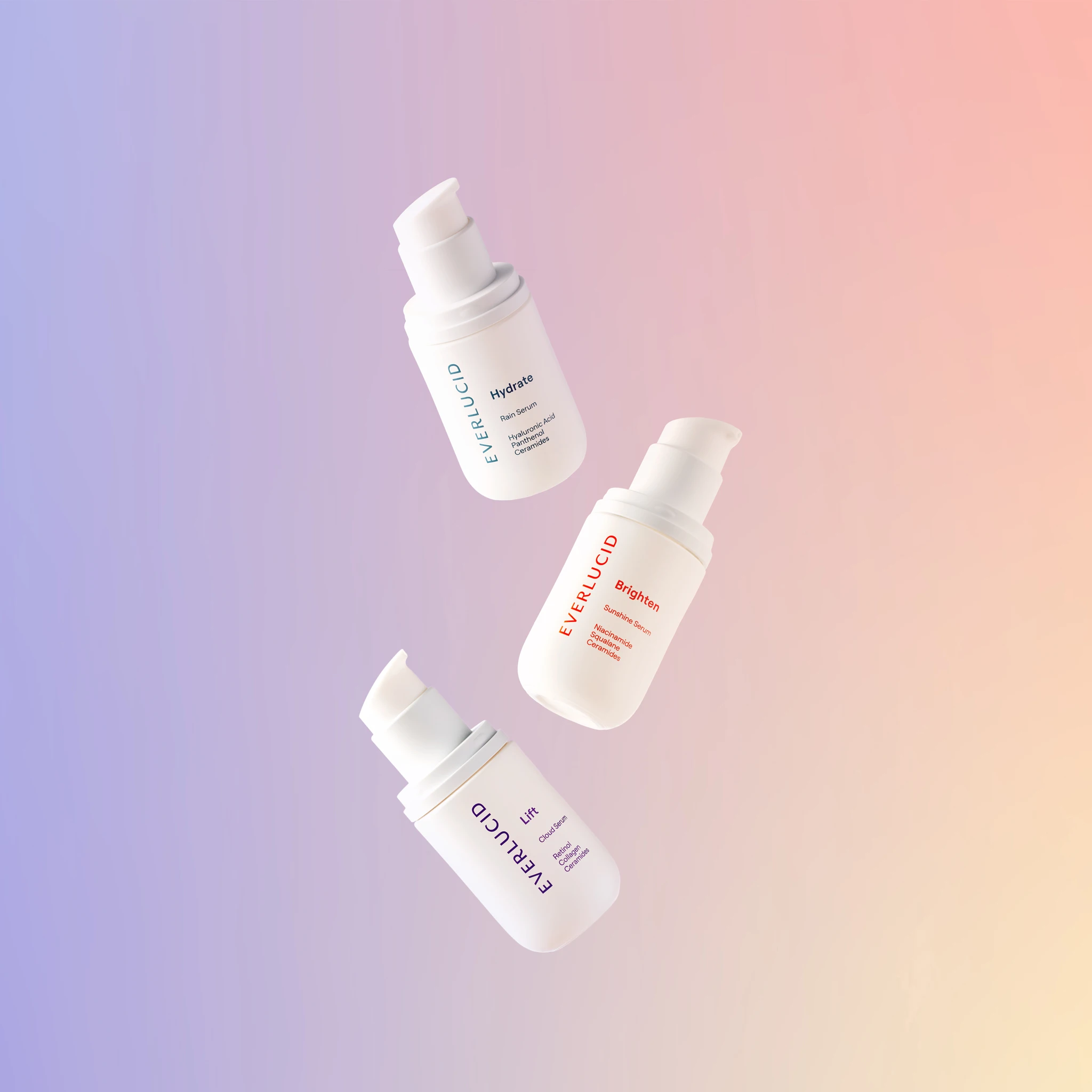 Three bottles of a white liquid on a purple background.