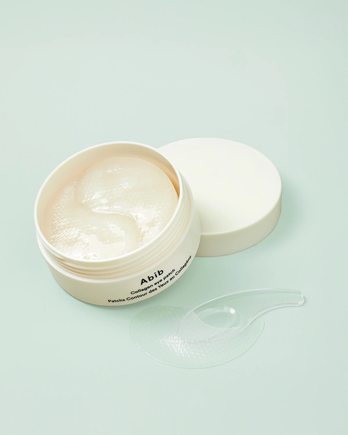 A white container of Abyb cream.