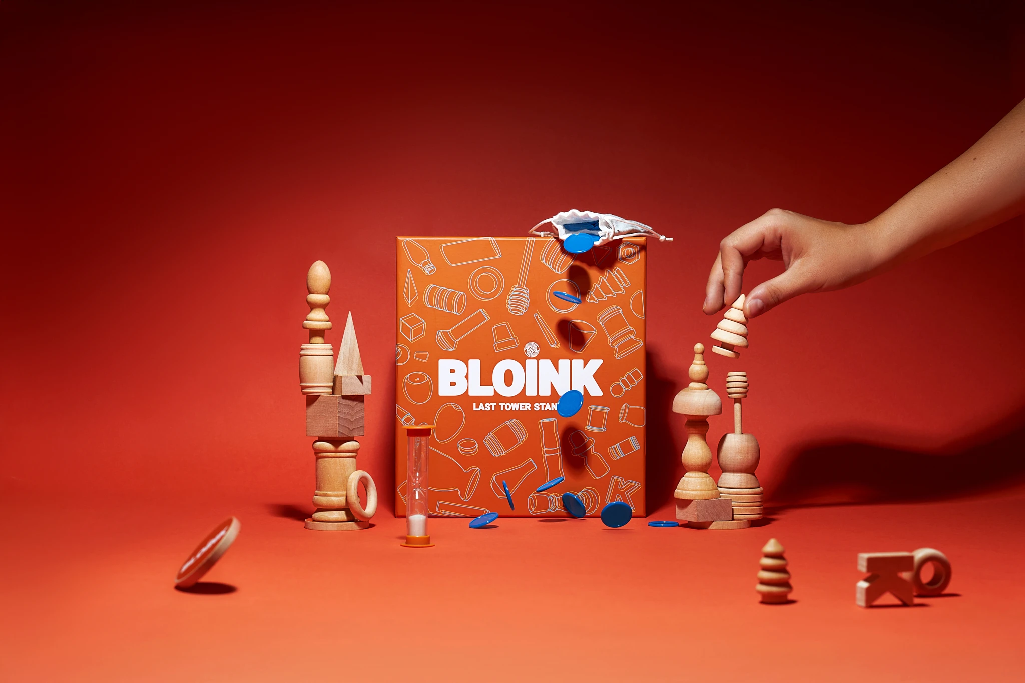 A box of wooden toy blocks with a red background of the Bloink Game