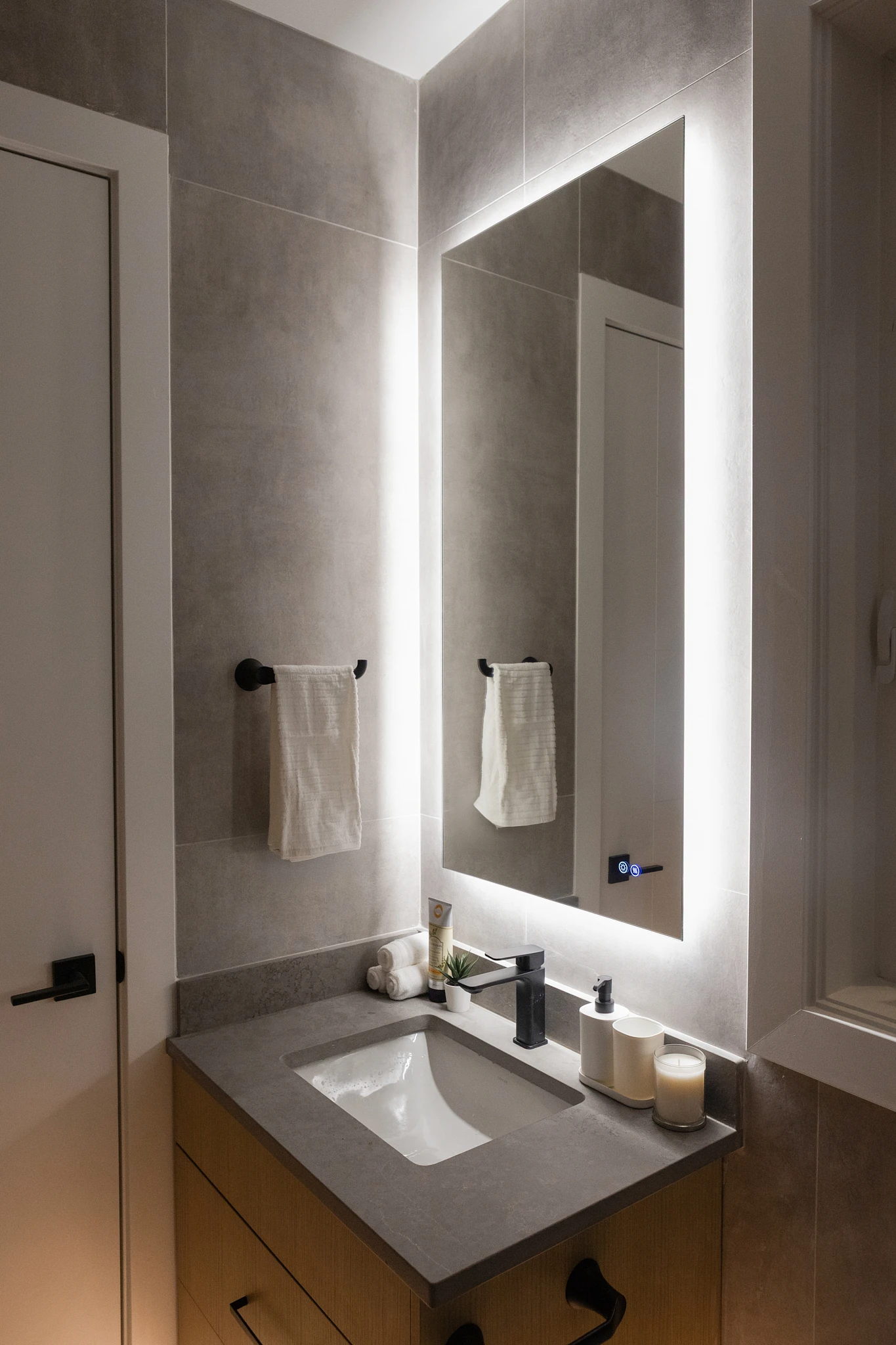 A bathroom sink with a mirror above it.