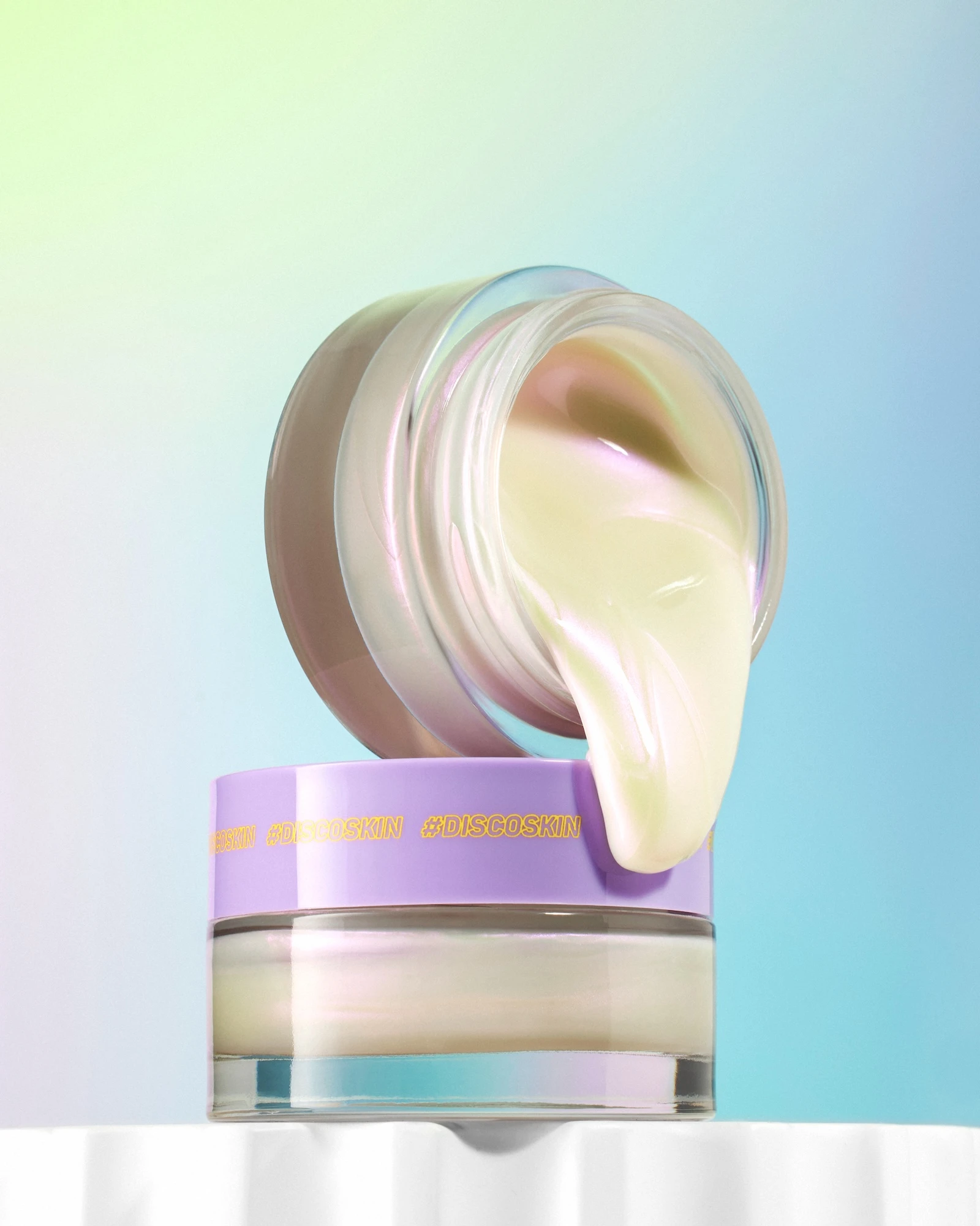 A bottle of lotion with a Comme Deux