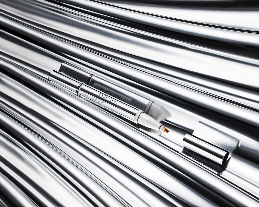 A silver tube with a white object in it.