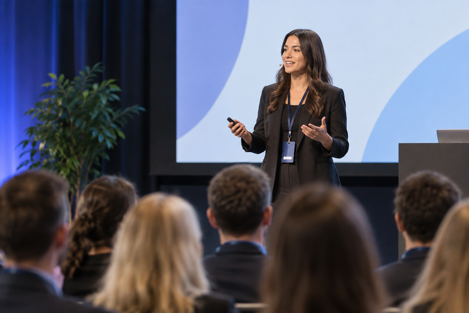Keynote speaker presenting to an audience at a conference