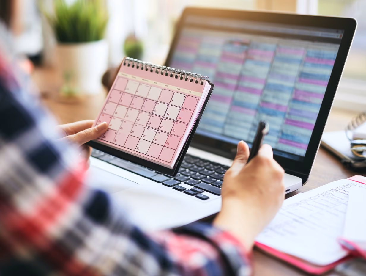 Beginner short-term rental host planning a listing at a desk with calendar and checklist