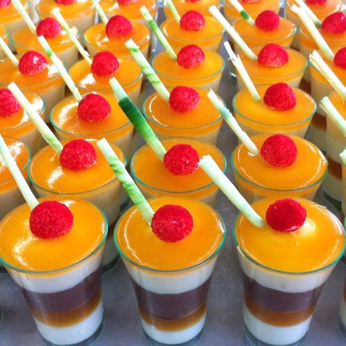 layers of chocolate mousse and passionfruit cream in a glass