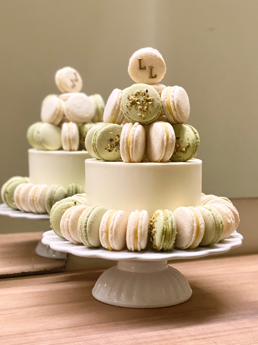 Wedding cake with a macaron tower on top
