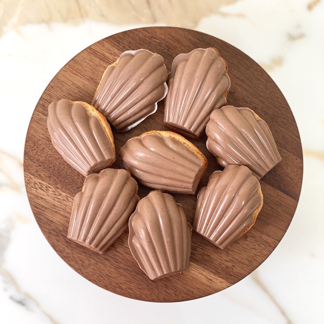 Soft honey and coffee madeleines with coffee milk chocolate coat