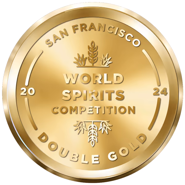A gold coin with the words San Francisco World Spirits Competition on it.