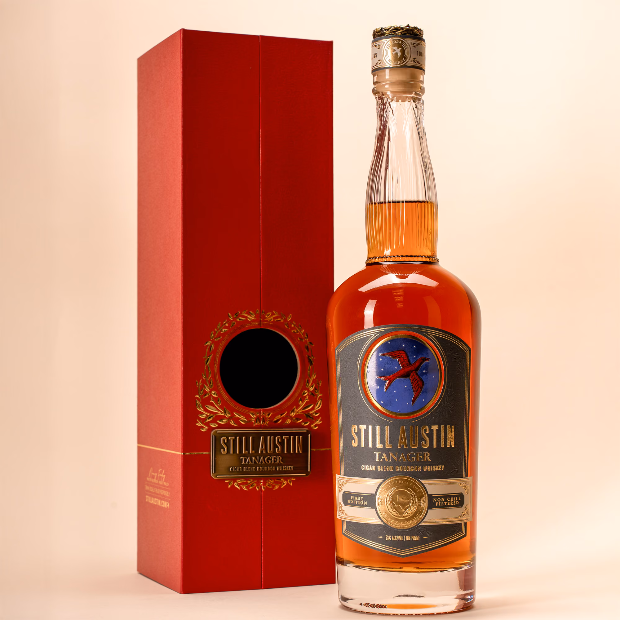 A bottle of Still Austin Tanager whiskey on a table