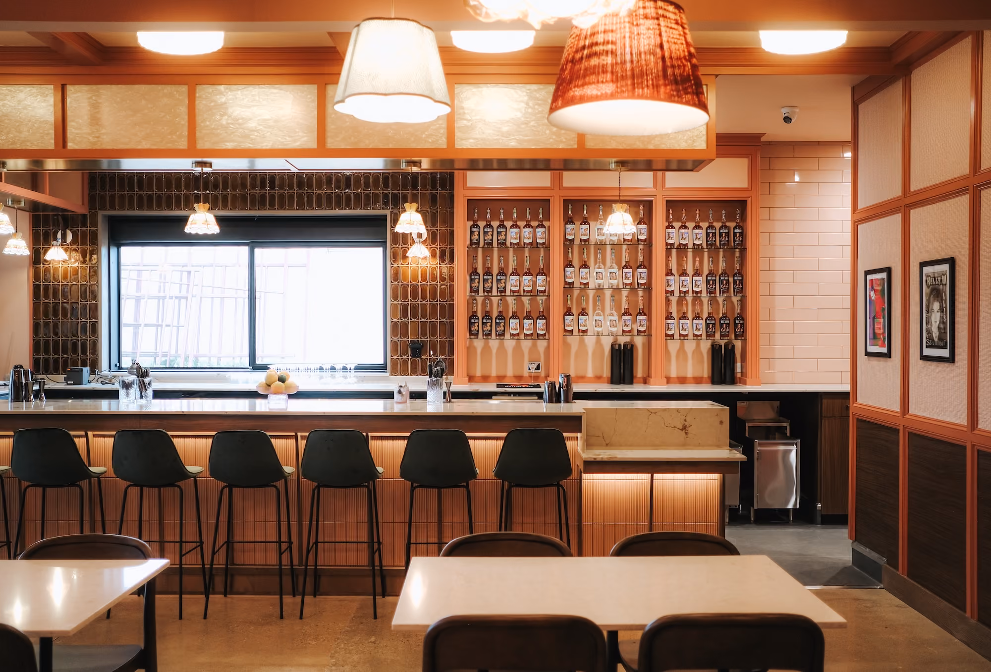 The Quarter bar with pendant lights and stools