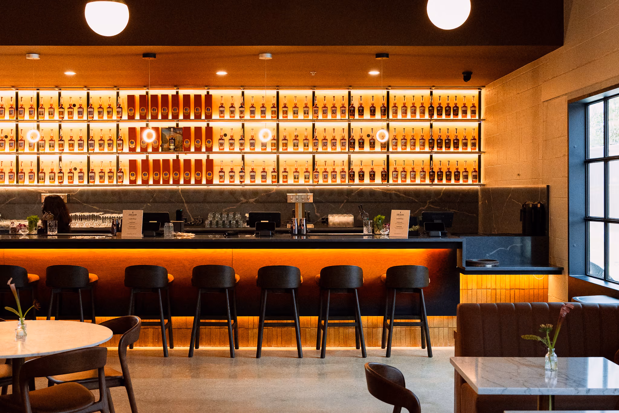 The back bar lined with bottles