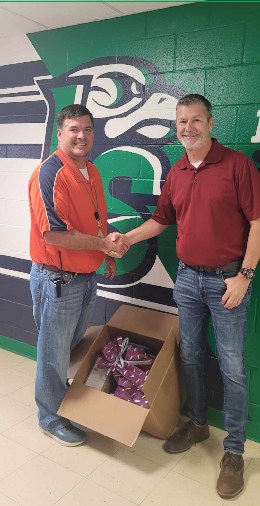 FTI team member delivers donations in the community.