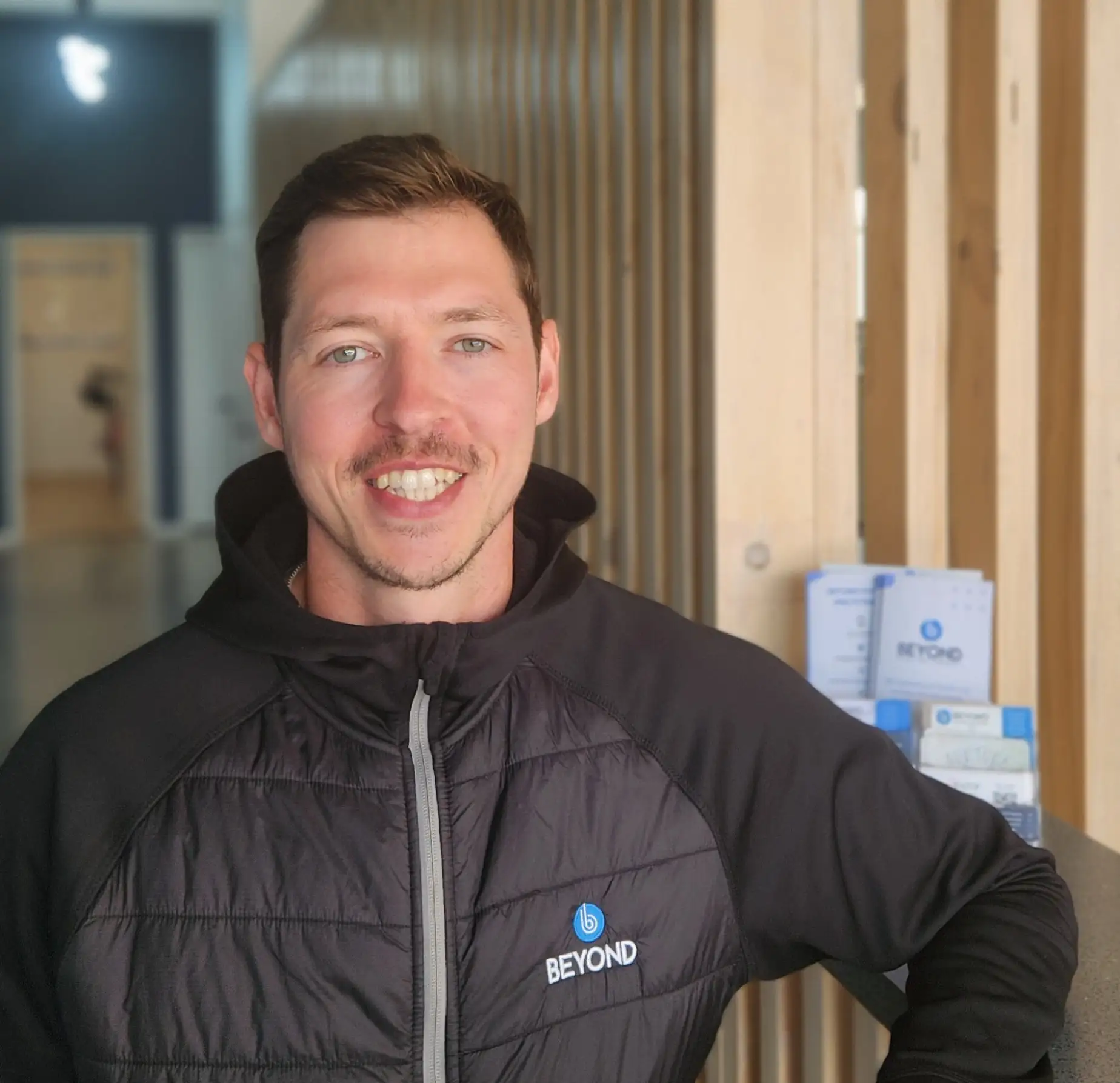 Male physio smiling
