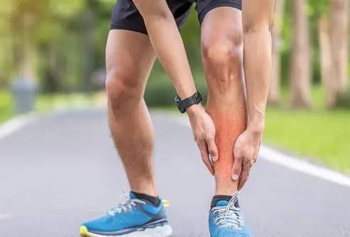 runner holding there shin