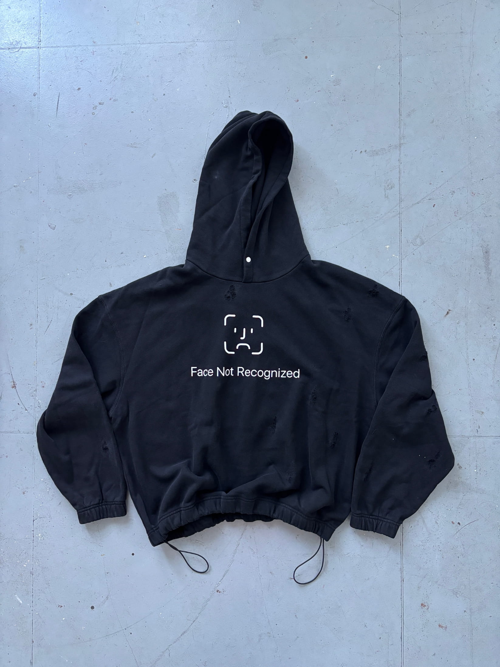 Streetwear photoshoot featuring OUTLW USA clothing on model in urban setting