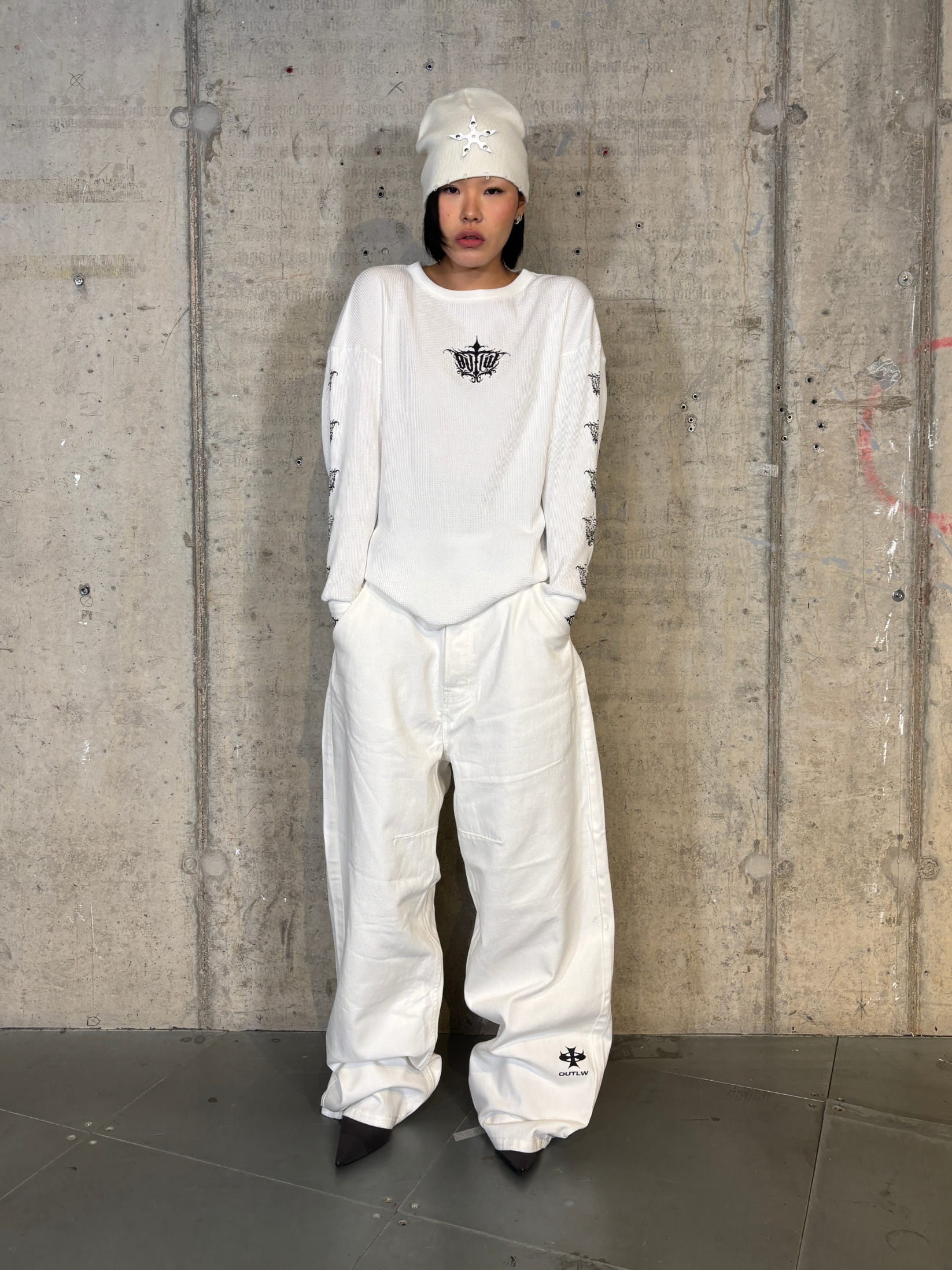 Off-white streetwear work pant with embroidered logo and baggy fit 