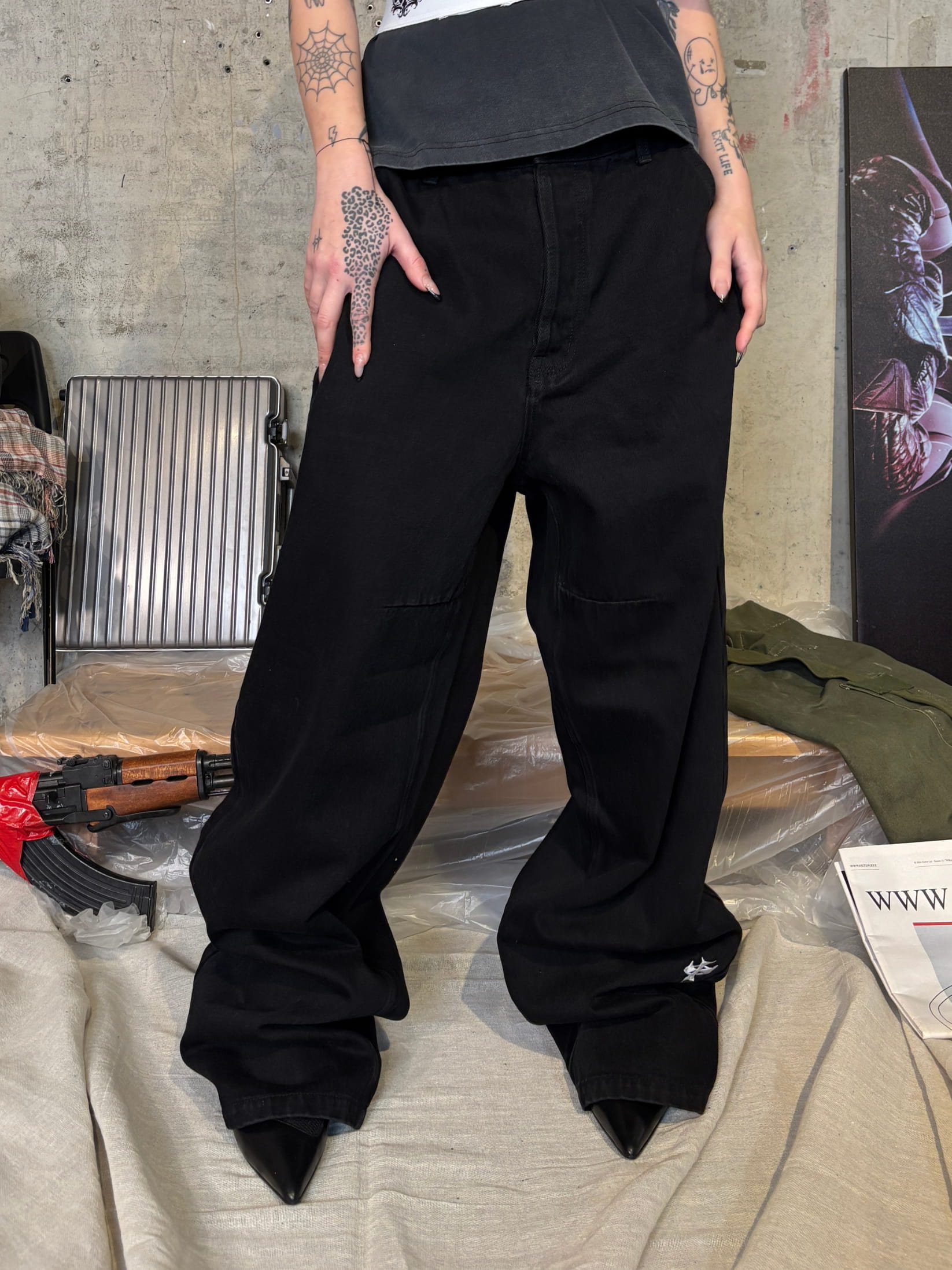 Black streetwear work pant with embroidered logo and baggy fit