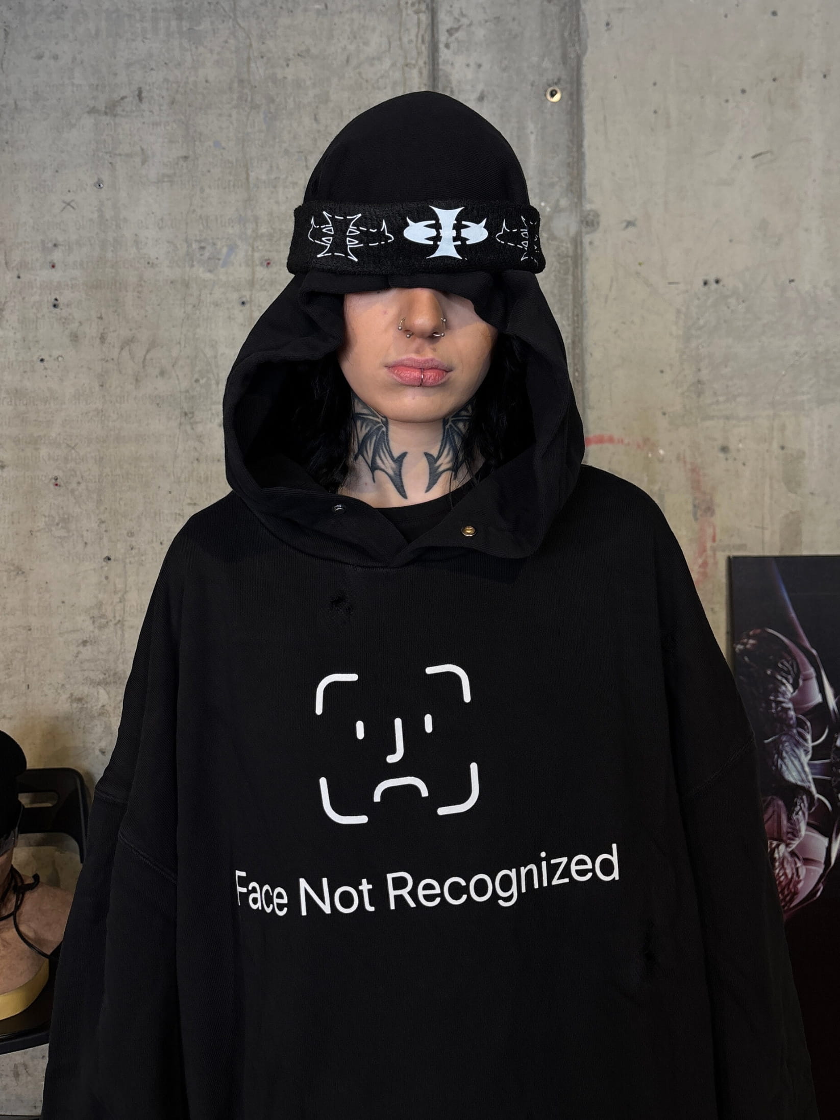 Streetwear photoshoot featuring OUTLW USA clothing on model in urban setting