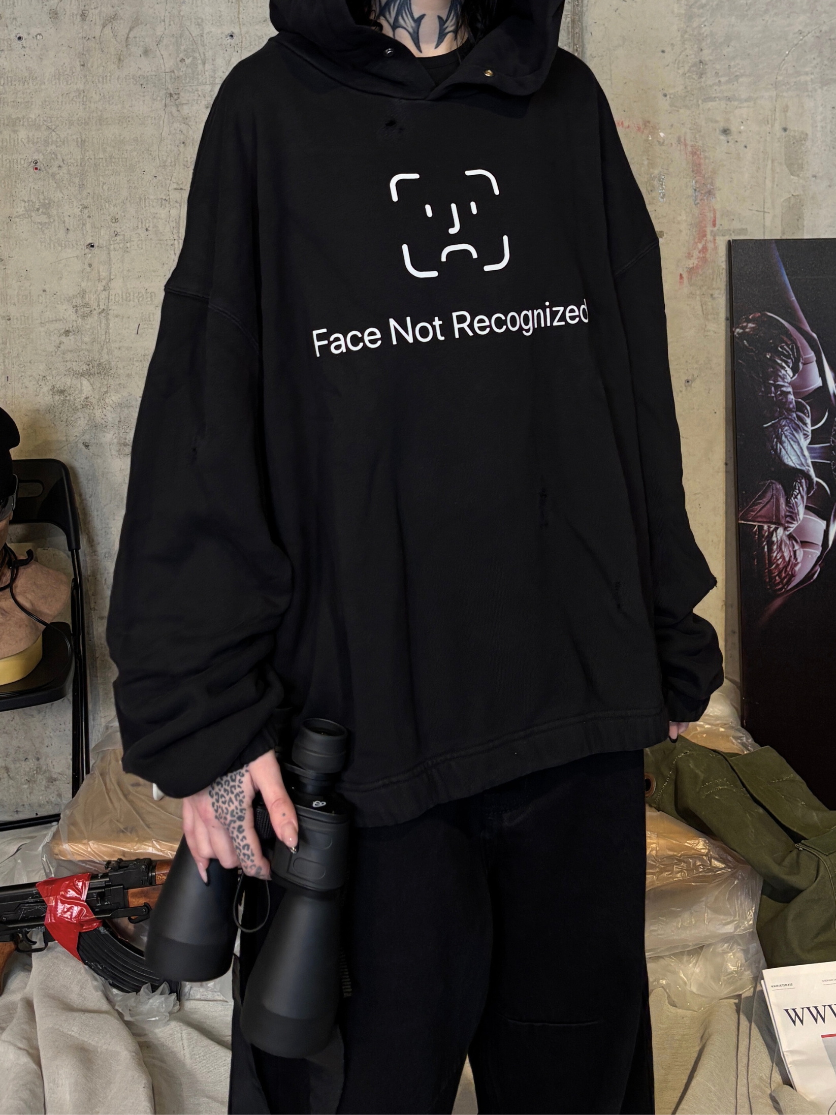 Streetwear photoshoot featuring OUTLW USA clothing on model in urban setting