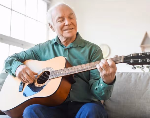 Resident playing the guitar