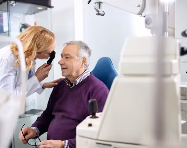 Oxa Care's optometrist examining elderly resident
