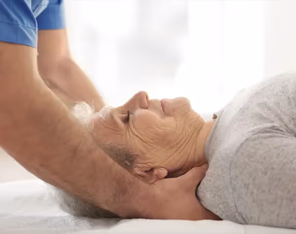 Oxa Care's massage therapist working with elderly resident