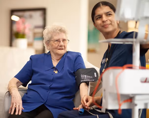 Oxa Care's occupational therapist reviewing elderly resident