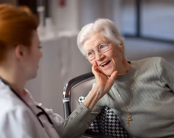 Oxa Care's residential aged care GP doctor examining elderly resident