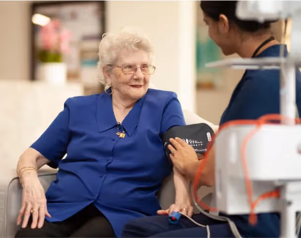 Oxa Care's residential aged care nurse assessing elderly residents pain management