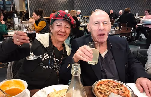Oxa Care residents activity dining out at Excelsior Hotel Thomastown saying cheers