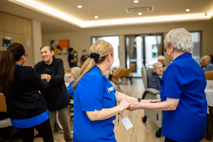 Oxa residents dancing with the staff