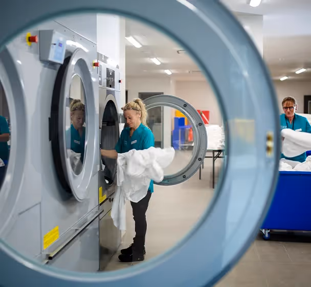 Oxa Care staff working in laundry