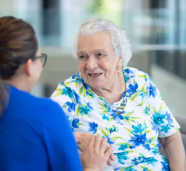 Oxa resident with a member of care staff