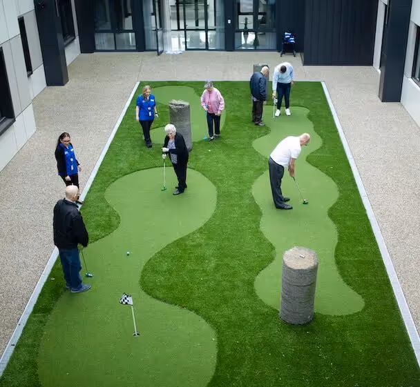 Residents playing mini golf