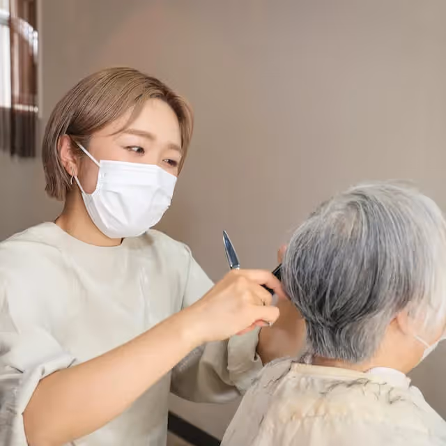 Hairdresser wearing a mask