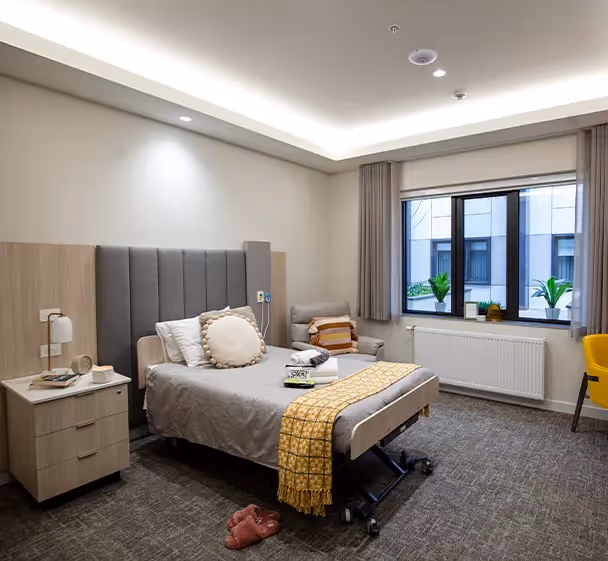 A double bed in a spacious bedroom