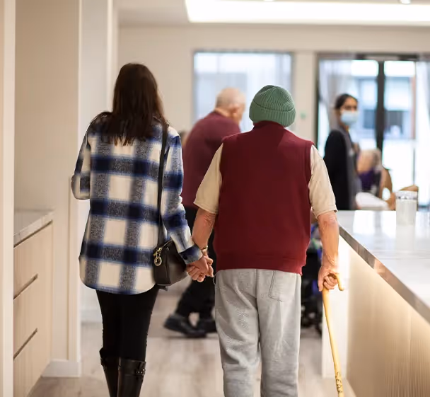 Oxa Care resident safely walking with family member