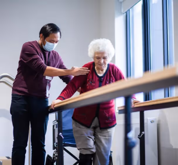 Nurse helping resident with pain management