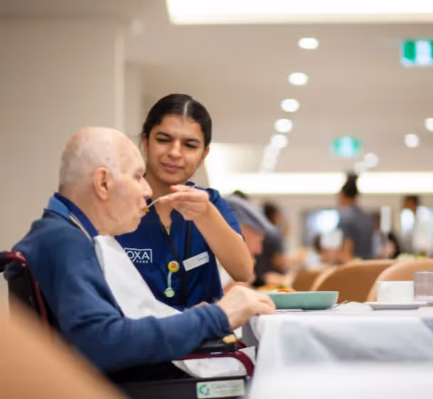 Oxa Care nurse feeding resident