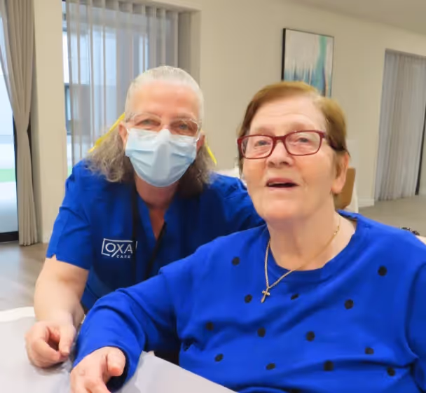 Resident and care team staff smiling for the camera