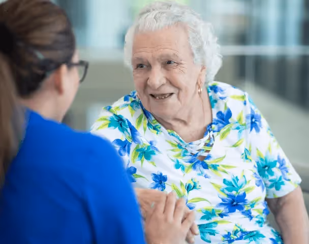 Resident talking to a care team staff member
