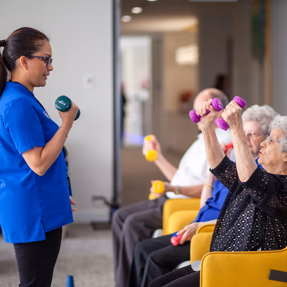 Seniors in South Morang aged care home enjoying light exercise sessions guided by trained nursing staff.