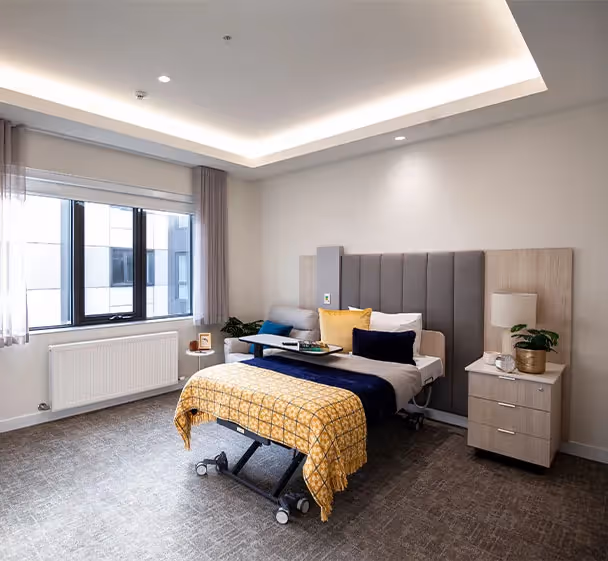 Spacious private room with ensuite at South Morang aged care facility featuring modern furnishings.
