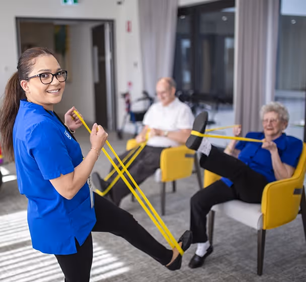 Residents at Oxa Care Mernda aged care home doing group fitness together.