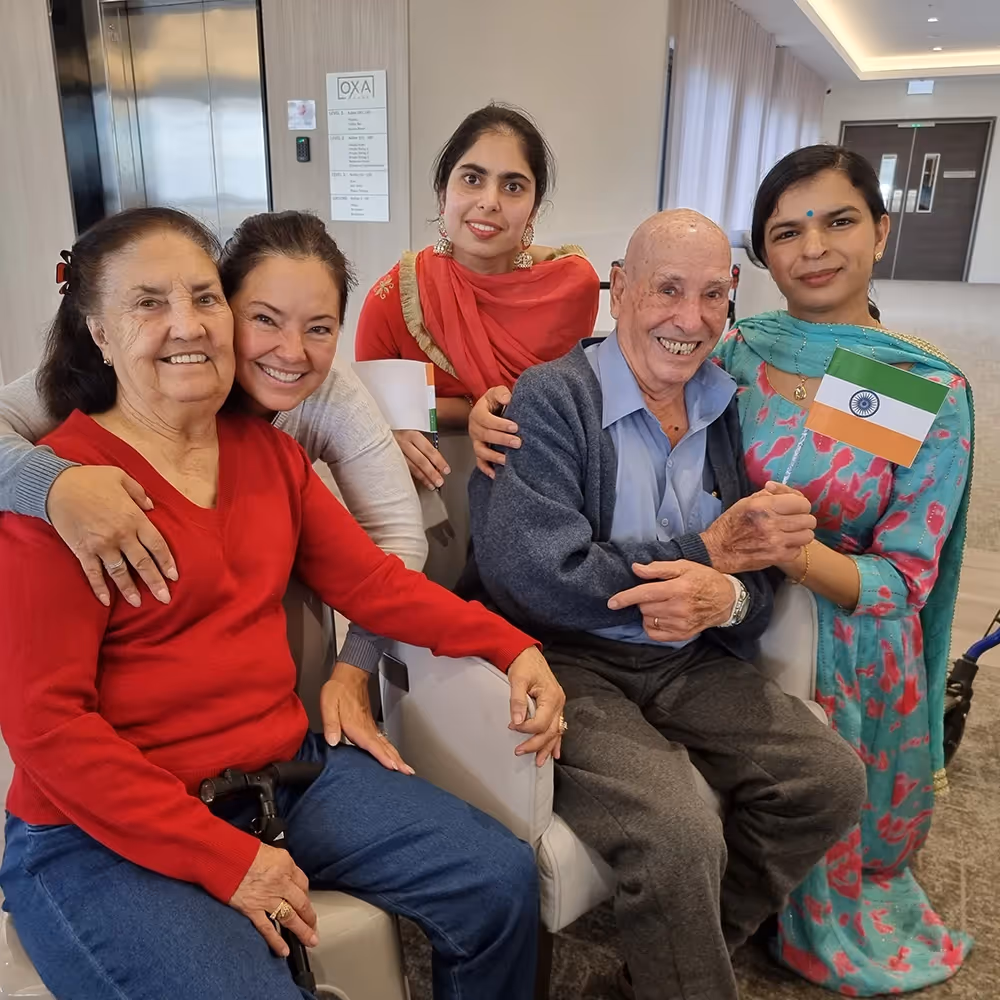 Thomastown residents celebrating cultural events with family and staff at Oxa Care aged care home.]