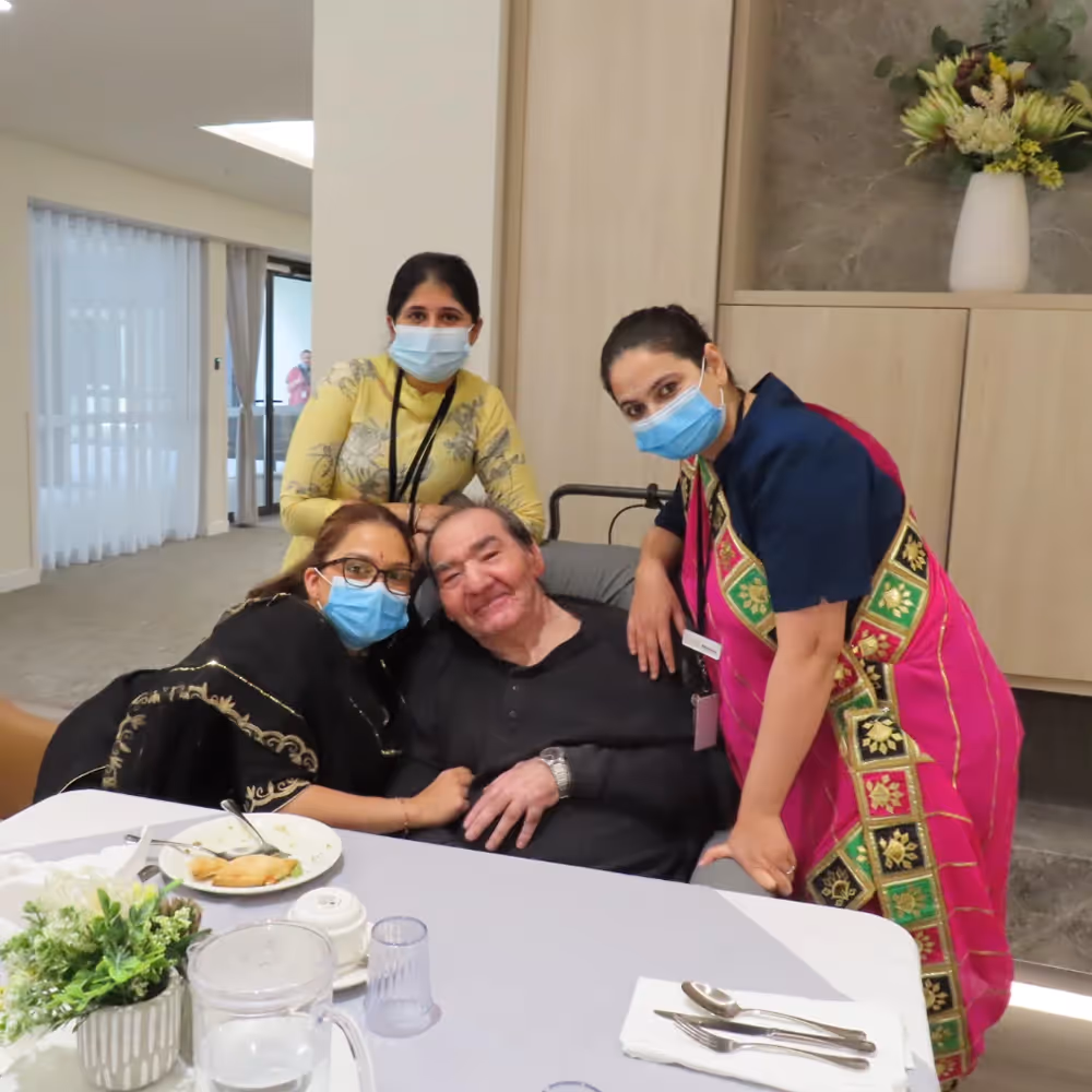 Resident in Plenty receiving warm support from multicultural aged care staff.